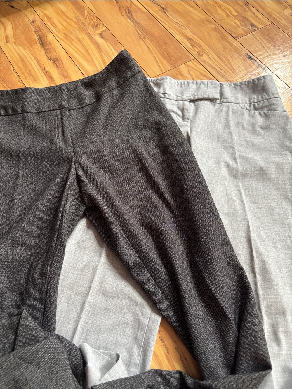 Bundle of two pair dress pants. Light  grey and dark grey.